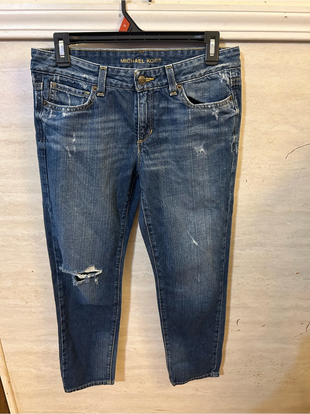 Michael Kors distressed
boyfriend ankle jeans